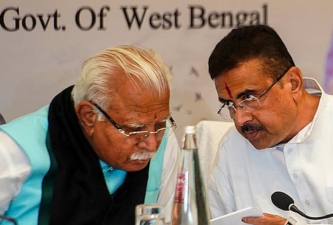 Union Minister Manohar Lal Khattar, left, and West Bengal Chief Minister Suvendu Adhikari during the launch of 'Swachh' app, a dedicated, geo-tagged mobile application for cleanliness, in Kolkata, West Bengal.
