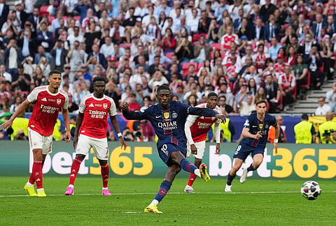 PSG's Ousmane Dembele scores from the penalty spot his side's opening goal during the Champions League final soccer match between Paris Saint-Germain and Arsenal in Budapest, Hungary.