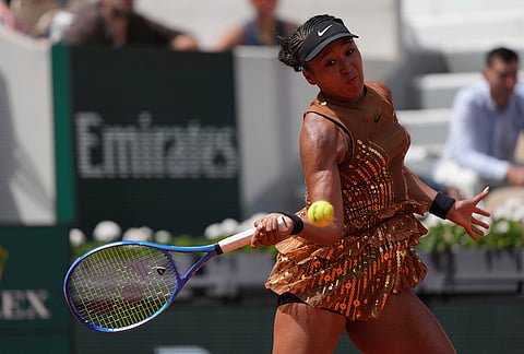 Naomi Osaka of Japan returns to Iva Jovic of the U.S. during their third round women's singles tennis match at the French Open tennis tournament in Paris.
