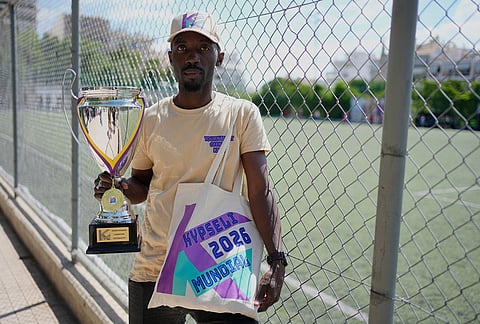 Mousa Sangare for Ivory Coast co-founder of Kypseli Mundial poses with the trophy in Athens, Greece.