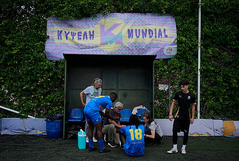 Migrants from Congo prepare before a semifinal soccer match against Mali during the Kypseli Mundial in Athens, Greece.