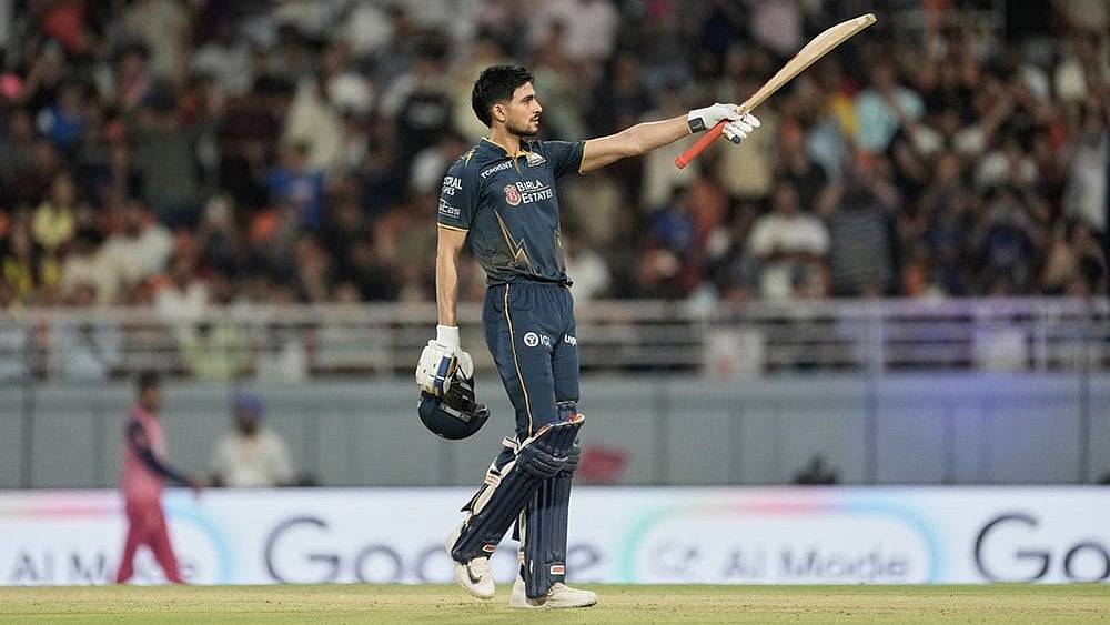 Gujarat Titans' captain Shubman Gill celebrates his century during the Indian Premier League cricket match between Gujarat Titans and Rajasthan Royals in New Chandigarh, India. - | Photo: AP/Ashwini Bhatia