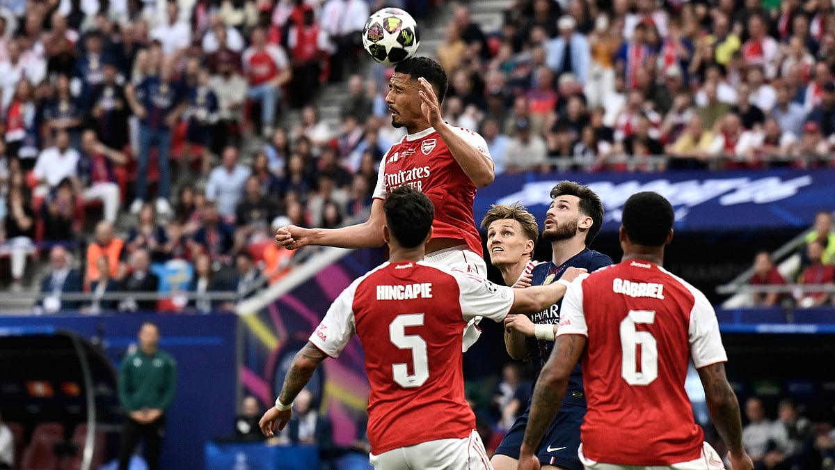 Arsenal's William Saliba, top, heads the ball during the Champions League final soccer match between Paris Saint-Germain and Arsenal in Budapest, Hungary, Saturday, May 30, 2026 - AP