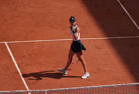 Iva Jovic of the U.S. reacts as she plays against Naomi Osaka of Japan during their third round women's singles tennis match at the French Open tennis tournament in Paris.