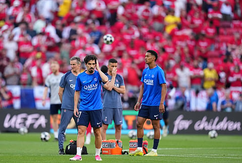 PSG's Vitinha warms up before the Champions League final soccer match between Paris Saint-Germain and Arsenal in Budapest, Hungary.