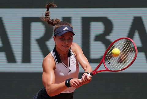 Iva Jovic of the U.S. returns to Naomi Osaka of Japan during their third round women's singles tennis match at the French Open tennis tournament in Paris.
