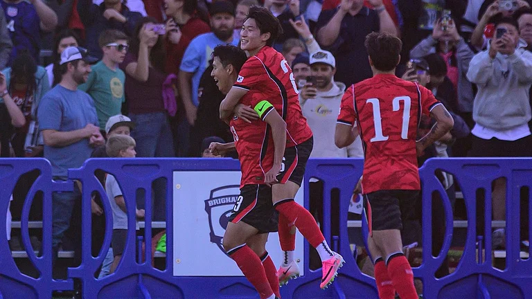 South Korea midfielder Son Heung-min, left, and Bae Jun-ho, center, celebrate a goal during the first half of an international friendly soccer match against Trinidad and Tobago, Saturday, May 30, 2026, in Provo, Utah. (AP Photo/Tyler Tate) - AP Photo/Tyler Tate