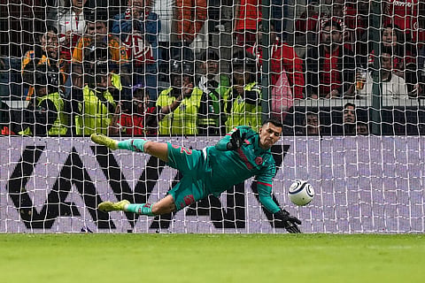 Toluca's goalkeeper Luis Garcia blocks a shot by Tigres' Fernando Gorriaran during a penalty shootout on the CONCACAF Champions Cup final soccer match in Toluca, Mexico, Saturday, May 30, 2026. ()