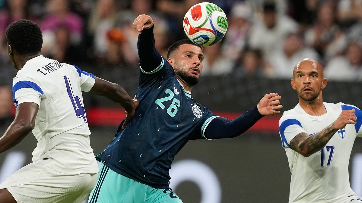 Germany’s Deniz Undav, center, tries controls the ball past Finland ‘s Tony Miettinen, left, and Nikolai Alho during the friendly soccer match between Germany and Finland in Mainz, Germany, Sunday, May 31, 2026. - | Photo: AP/Michael Probst