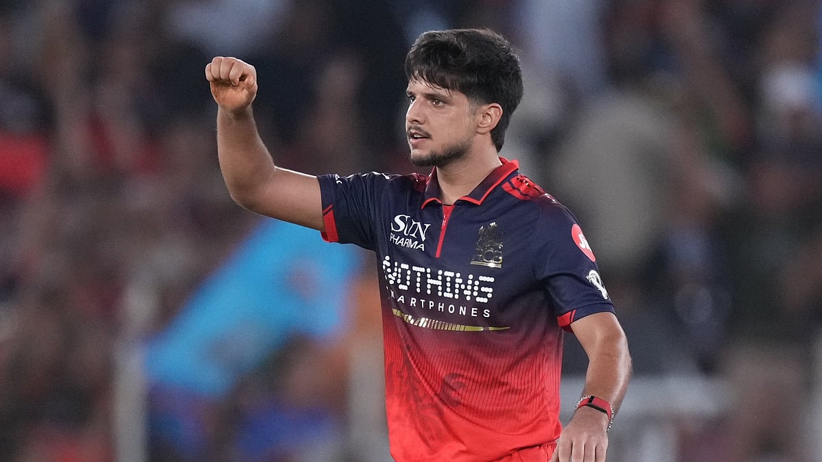 Royal Challengers Bengaluru's Rasikh Dar celebrates the wicket of Gujarat Titans' Nishant Sindhu during the Indian Premier League final cricket match between Gujarat Titans and Royal Challengers Bengaluru in Ahmedabad, India, Sunday, May 31, 2026. - AP