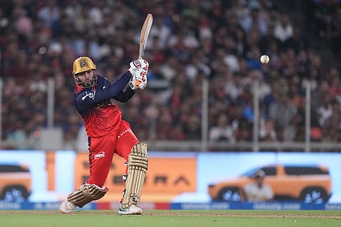 Royal Challengers Bengaluru's Jitesh Sharma plays a shot during the Indian Premier League final cricket match between Gujarat Titans and Royal Challengers Bengaluru in Ahmedabad, India.