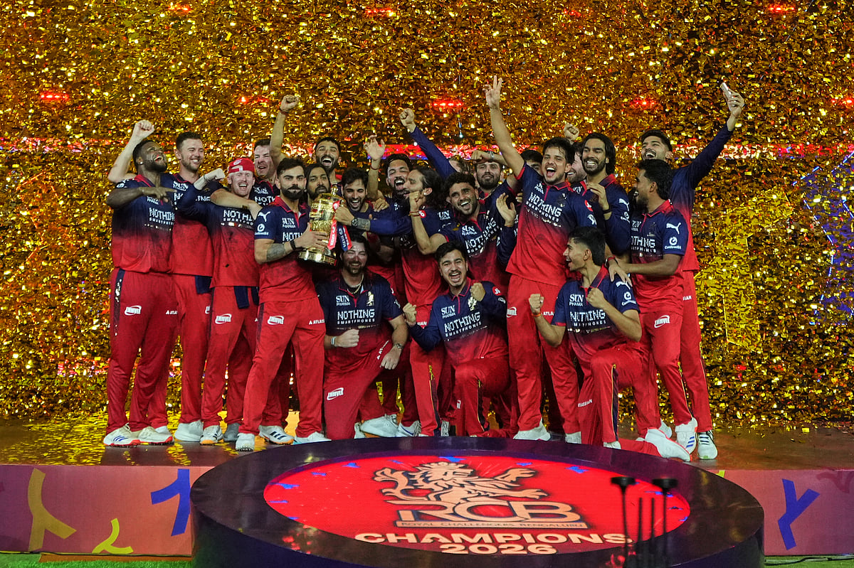 AP Photo/Ajit Solanki : Royal Challengers Bengaluru players celebrate with the trophy after beating Gujarat Titans in the Indian Premier League 2026 final in Ahmedabad, India, Monday, June 1, 2026.