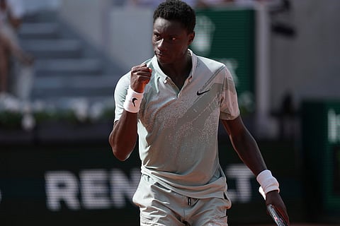 Moise Kouame of France reacts as he plays against Alejandro Tabilo of Chile during their third round men's singles tennis match at the French Open tennis tournament in Paris.