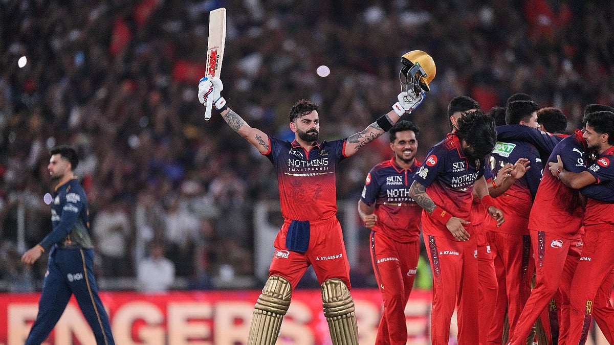 Royal Challengers Bengaluru's Virat Kohli celebrates with teammates after their win in the Indian Premier League final cricket match against Gujarat Titans in Ahmedabad. - AP Photo