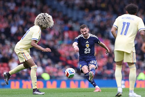 Scotland's Kenny McLean, shoots at goal during an international friendly soccer match between Scotland and Curacao in Glasgow, Scotland.