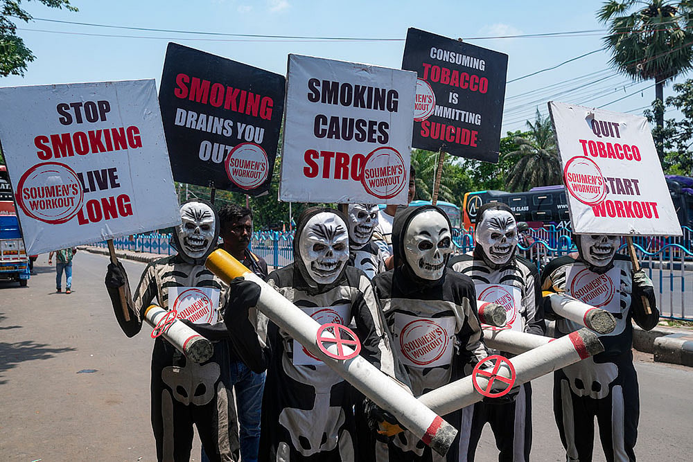 People take part in an awareness rally on the World No Tobacco day, in Kolkata. - | Photo: PTI/Swapan Mahapatra