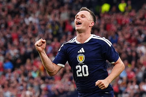 Scotland's Lawrence Shankland celebrates scoring during an international friendly match between Scotland and Curacao in Glasgow.