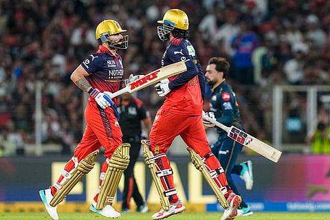 Royal Challengers Bengaluru's Virat Kohli, left, and Venkatesh Iyer run between the wickets during the Indian Premier League (IPL) 2026 Final T20 cricket match between Royal Challengers Bengaluru and Gujarat Titans, in Ahmedabad, Gujarat.