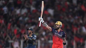 AP Photo : Royal Challengers Bengaluru's Virat Kohli celebrates his fifty runs during the Indian Premier League final cricket match between Gujarat Titans and Royal Challengers Bengaluru in Ahmedabad.