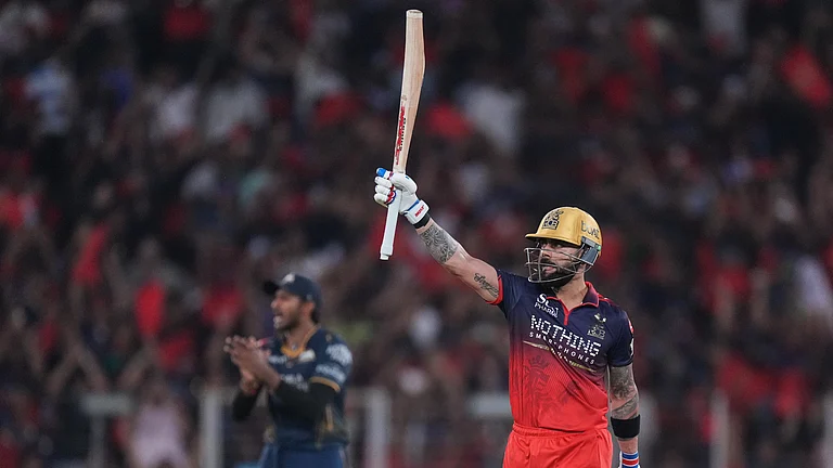 Royal Challengers Bengaluru's Virat Kohli celebrates his fifty runs during the Indian Premier League final cricket match between Gujarat Titans and Royal Challengers Bengaluru in Ahmedabad. - AP Photo