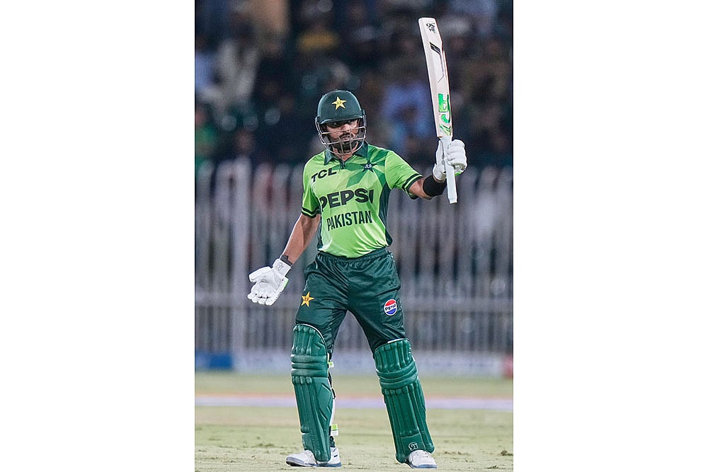 Pakistans Babar Azam celebrates after scoring fifty runs
