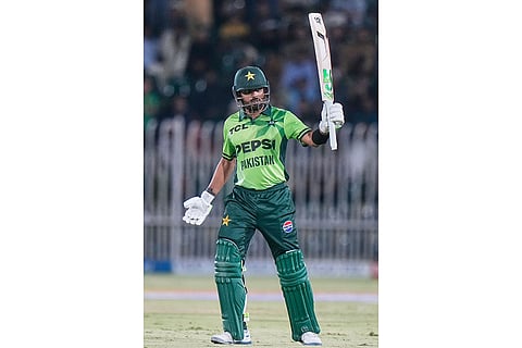 Pakistan's Babar Azam celebrates after scoring fifty runs during the first one day international cricket match between Pakistan and Australia, in Rawalpindi, Pakistan.
