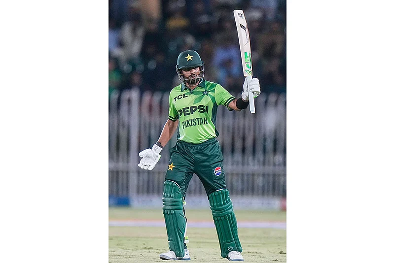 Pakistans Babar Azam celebrates after scoring fifty runs
