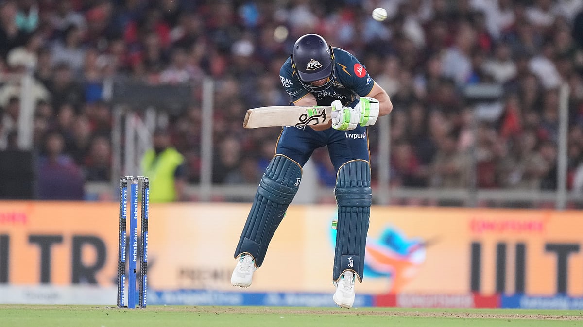Gujarat Titans' Jos Buttler ducks a bouncer of Royal Challengers Bengaluru's Josh Hazlewood during the Indian Premier League final cricket match between Gujarat Titans and Royal Challengers Bengaluru in Ahmedabad. - AP Photo