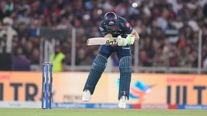 AP Photo : Gujarat Titans' Jos Buttler ducks a bouncer of Royal Challengers Bengaluru's Josh Hazlewood during the Indian Premier League final cricket match between Gujarat Titans and Royal Challengers Bengaluru in Ahmedabad.