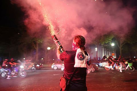 PSG supporters let off fireworks as they celebrate in Paris, Saturday, May 30, 2026 after the Champions League final soccer match between Paris Saint-Germain and Arsenal that was played in Budapest. PSG won the game.