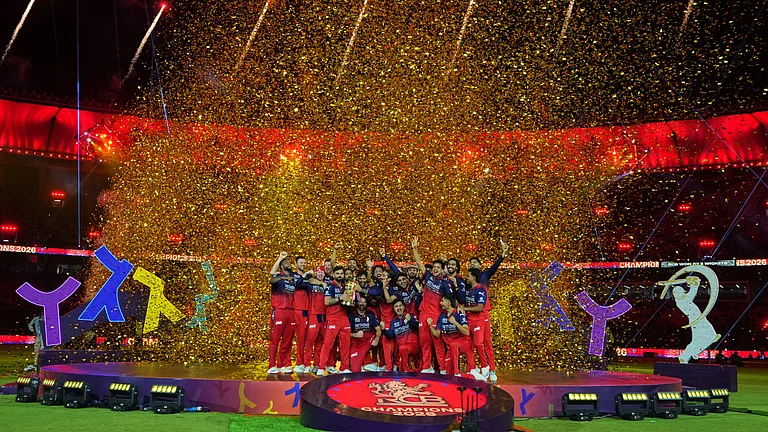 Royal Challengers Bengaluru players celebrate with winners trophy after their win in the Indian Premier League final cricket match against Gujarat Titans in Ahmedabad, India, Monday, June 1, 2026 - (AP Photo/Ajit Solanki)