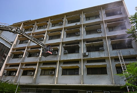 Firefighters at the site after a fire broke out on the second floor of the Ministry of Education office located within the School of Planning and Architecture (SPA) campus, in New Delhi.