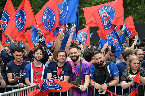 PSG's fans gather the day after winning the Champions League title, at the Eiffel Tower, in Paris.