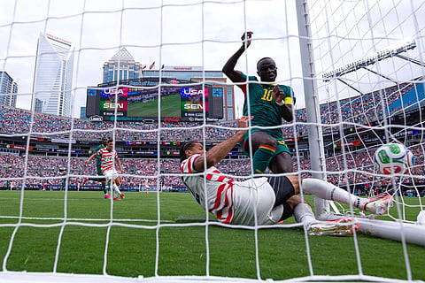 Senegal forward Sadio Mané (10) scores against United States defender Miles Robinson, bottom, during the second half of an international friendly soccer  in Charlotte, N.C.