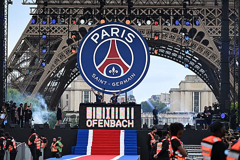 Artists perform ahead of PSG's celebrations the day after winning the Champions League title, at the Eiffel Tower, in Paris.
