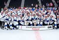 | Photo: AP/Darko Bandic : Finland players celebrate with trophy after winning the 2026 IIHF Men's Ice Hockey World Championship final match against Switzerland, in Zurich, Switzerland.
