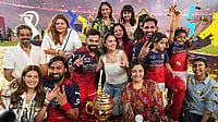 Photo: PTI/Ravi Choudhary : Royal Challengers Bengaluru's players and their family members celebrate with the tournament trophy after the team won the Indian Premier League (IPL) 2026 title, in Ahmedabad, Gujarat.