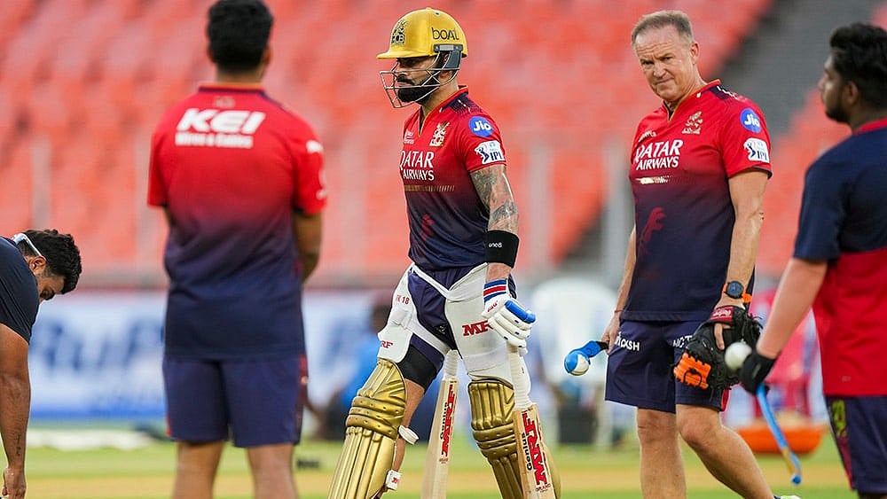 IPL: Virat Kohli (left) in training with coach Andy Flower (right). - | Photo: PTI/Arun Sharma