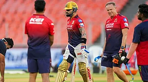 | Photo: PTI/Arun Sharma : IPL: Virat Kohli (left) in training with coach Andy Flower (right).