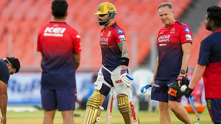 IPL: Virat Kohli (left) in training with coach Andy Flower (right). - | Photo: PTI/Arun Sharma