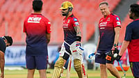 | Photo: PTI/Arun Sharma : IPL: Virat Kohli (left) in training with coach Andy Flower (right).