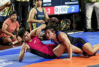 | Photo: PTI/Kamal Kishore : Wrestlers Antim Panghal, in red, and Meenakshi Goyat compete in the women's 53kg category final wrestling match during the Asian Games selection trials, in New Delhi.