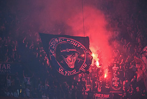 PSG fans celebrate their Champions League final victory against Arsenal at the Parc des Princes in Paris.