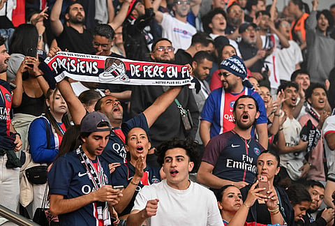 PSG fans celebrate their Champions League final victory against Arsenal at the Parc des Princes in Paris. 