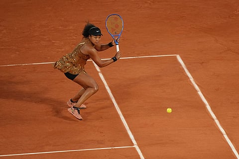 Japan's Naomi Osaka returns to Aryna Sabalenka of Belarus during the fourth-round tennis match at the French Open in Paris.