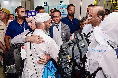 In this image posted on June 2, 2026, Jammu and Kashmir Chief Minister Omar Abdullah receives the first batch of Hajj pilgrims as they arrive from Mecca, Saudi Arabia, at Srinagar Airport, in Srinagar.
