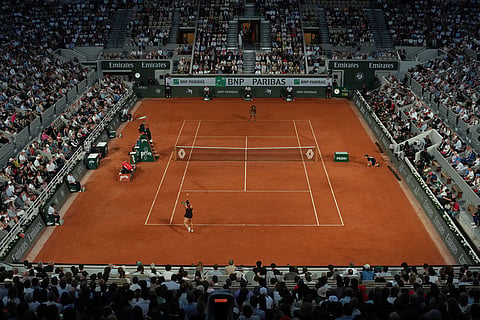 Fans watch the fourth-round tennis match between Japan's Naomi Osaka and Aryna Sabalenka of Belarus at the French Open in Paris.