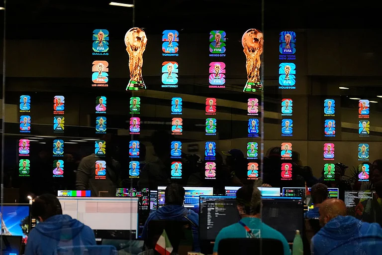 Workers are shown inside the Master Control Room during the opening ceremony of the International Broadcast Center in Dallas. - | Photo: AP/Tony Gutierrez