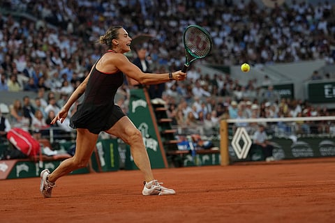 Aryna Sabalenka of Belarus returns to Japan's Naomi Osaka during the fourth-round tennis match at the French Open in Paris.