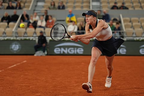 Ukraine's Elina Svitolina returns to Ukraine's Marta Kostyuk during the quarterfinal tennis match at the French Open in Paris.